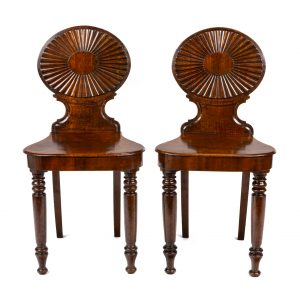 George III a pair of mahogany hall chairs attributed to Mayhew & Ince